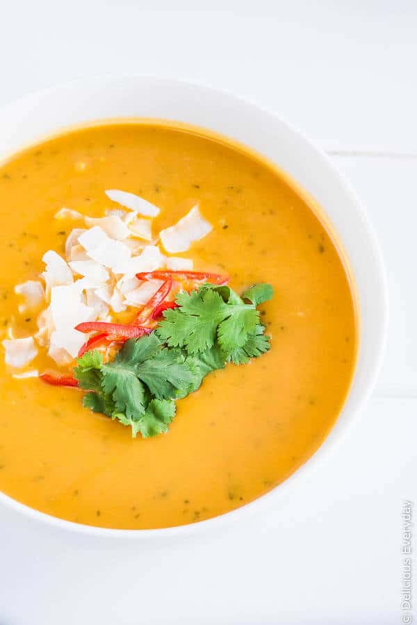 Thai Pumpkin Soup recipe - this delicious vegan pumpkin soup is the ultimate comfort food. Serve with a swirl of coconut milk and topped with coriander (cilantro) | Find the recipe at DeliciousEveryday.com