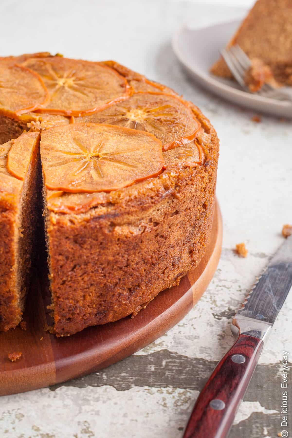 Upside down persimmon cake with maple syrup and walnuts - This gorgeous spiced upside down persimmon cake topped with finely sliced persimmon in maple syrup is a great introduction to persimmons. | Click for the recipe