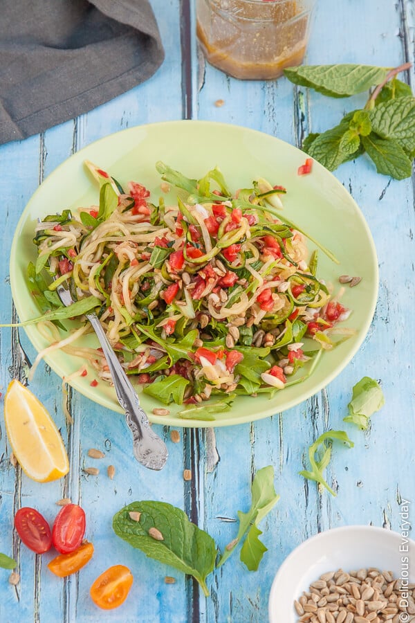 Zucchini Noodle Salad Recipe - this vegan salad is packed full of veggie goodness with zucchini noodles, tomato, mint and more. | Get the recipe at DeliciousEveryday.com