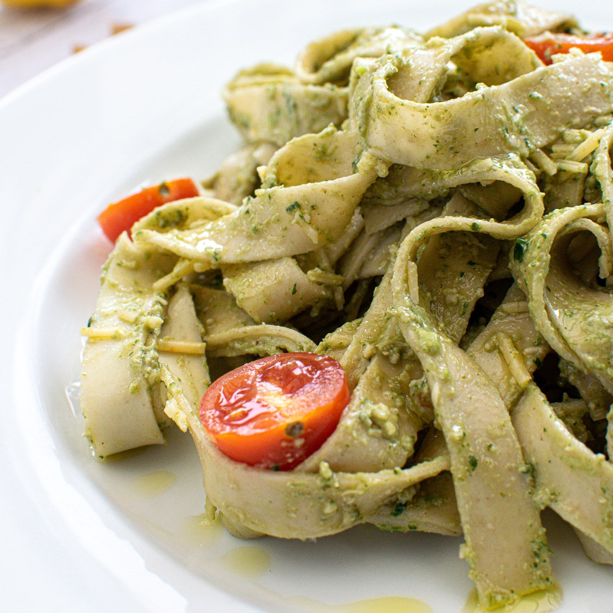 close up of vegan avocado spinach pasta on plate