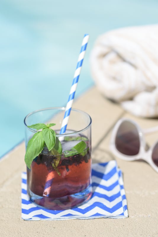 blackberry ginger gin cocktail by the pool