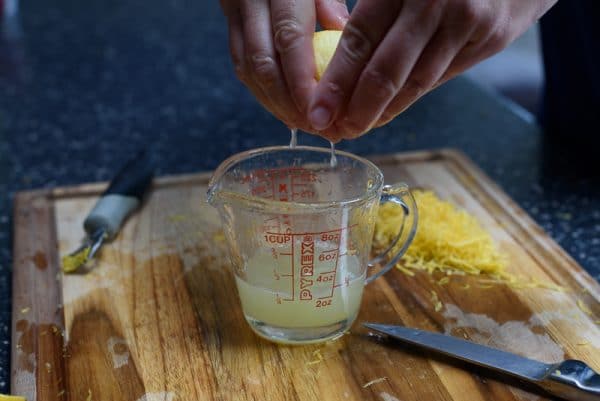 woman demonstrating how to juice a lemon