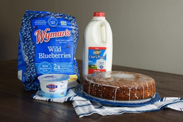 blueberry lemon cake with ingredients on a table