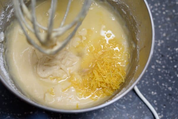 adding lemon zest and juice to the cake batter