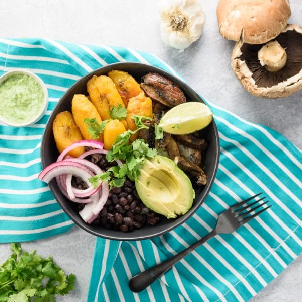 vegan buddha bowl being served on a table