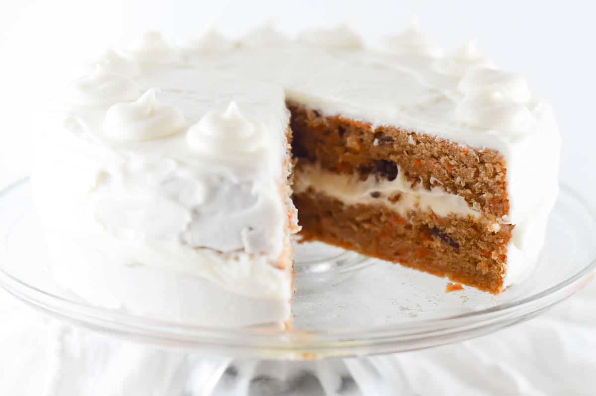 carrot cake with pineapple with a slice cut out