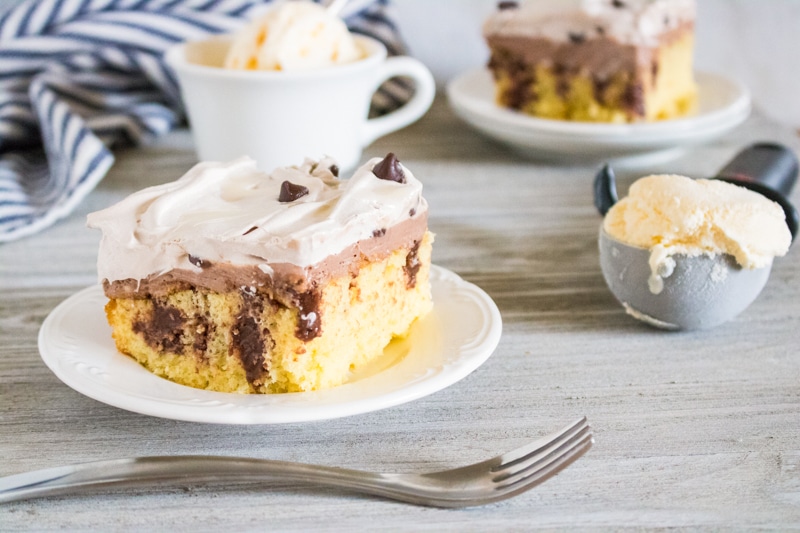 triple chocolate poke cake on a serving dish