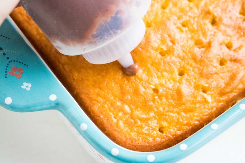 poking holes in the poke cake