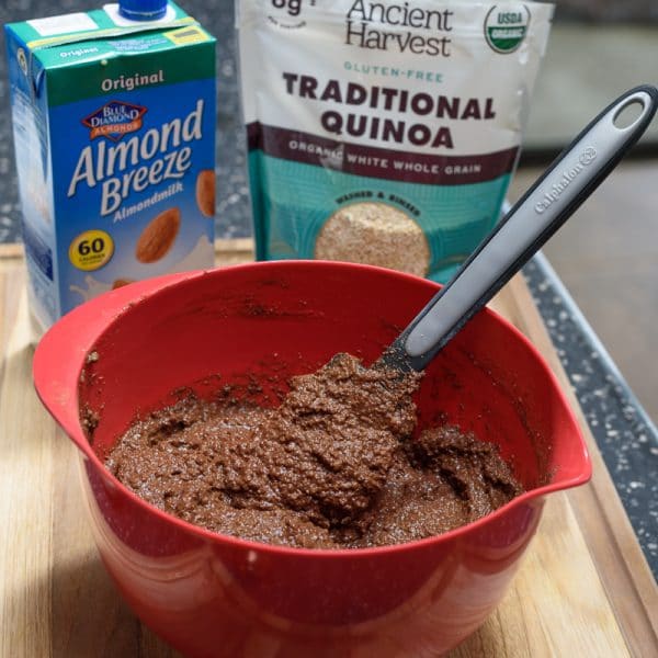 prepared vegan chocolate quinoa cake batter in a red bowl