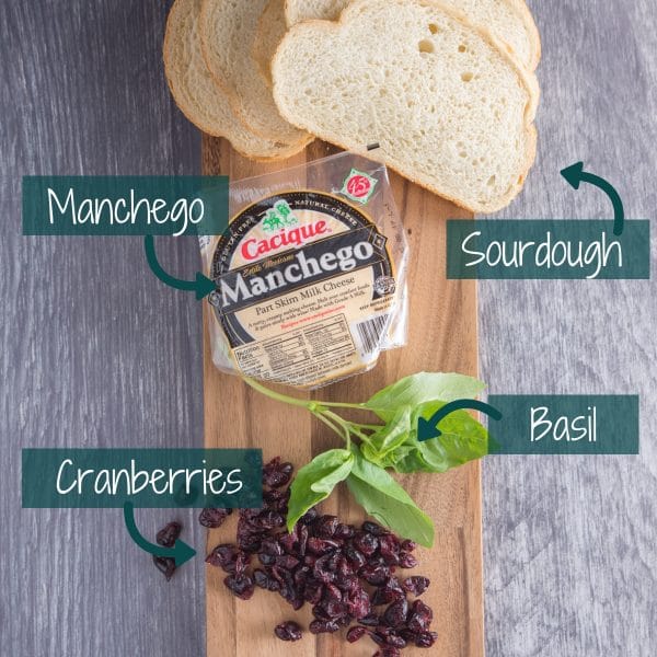 manchego cheese, sourdough bread, and cranberries for grilled cheese