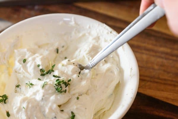 mixing goat cheese tart filling