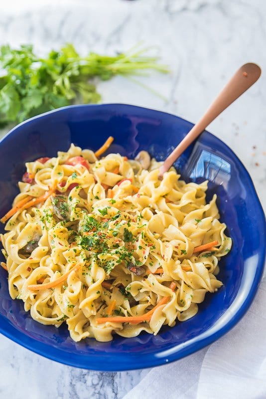 thai green curry noodles in a bowl