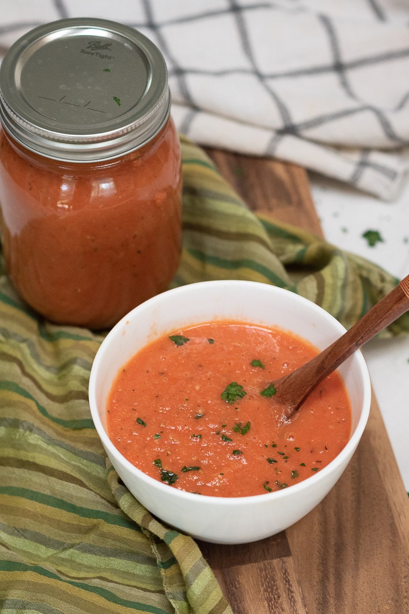 homemade tomato sauce in a white bowl on coutertop