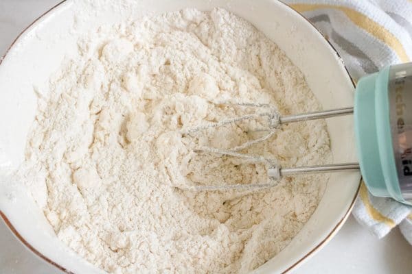 mixing the batter for homemade buttermilk biscuits