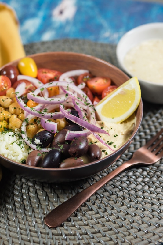 easy vegan hummus bowl being served in a bowl