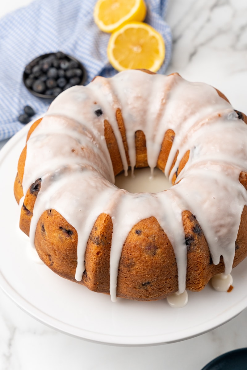 overhead view of the lemon blueberry bundt cake on a white serving platter