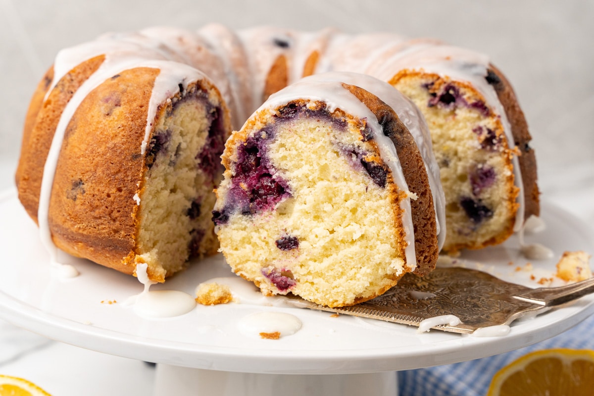 lemon blueberry bundt cake being sliced for serving