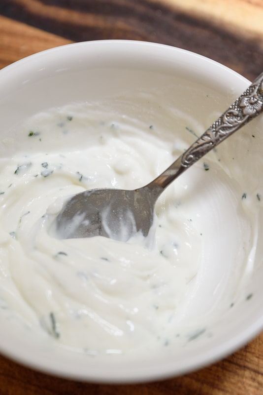 mixing vegan cilantro lime sour cream