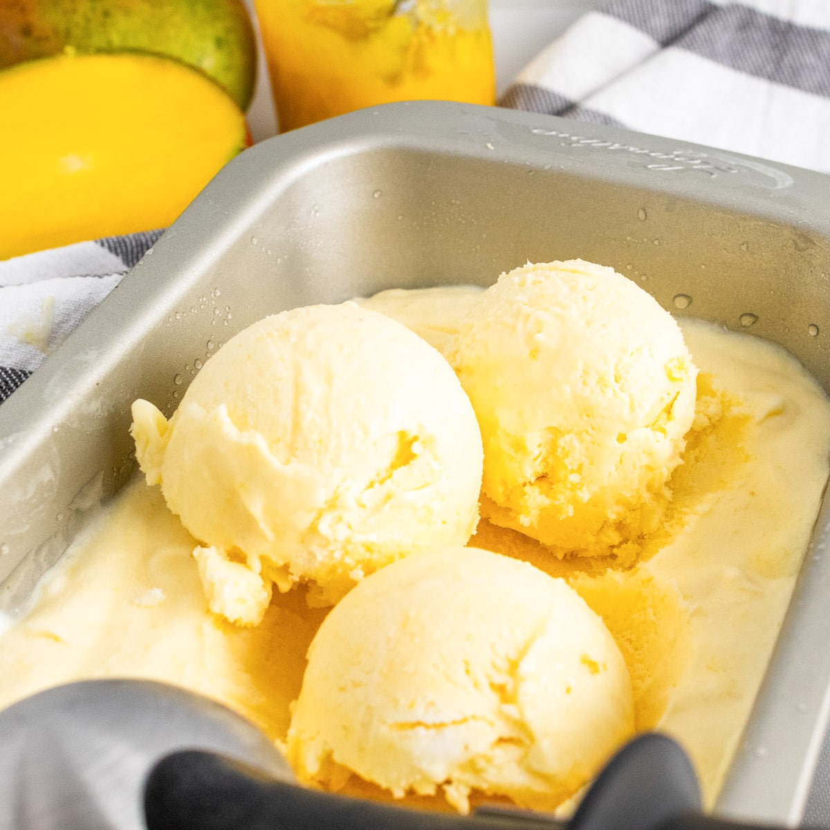 scoops of homemade mango ice cream side view
