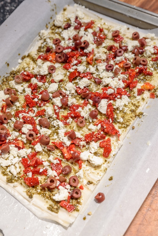 mediterranean flatbread ready to go in the oven