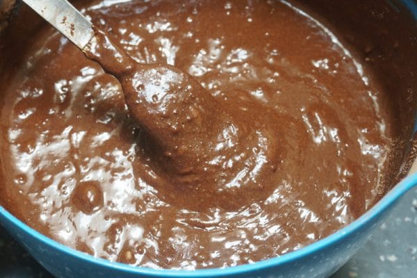 stirring olive oil brownie batter