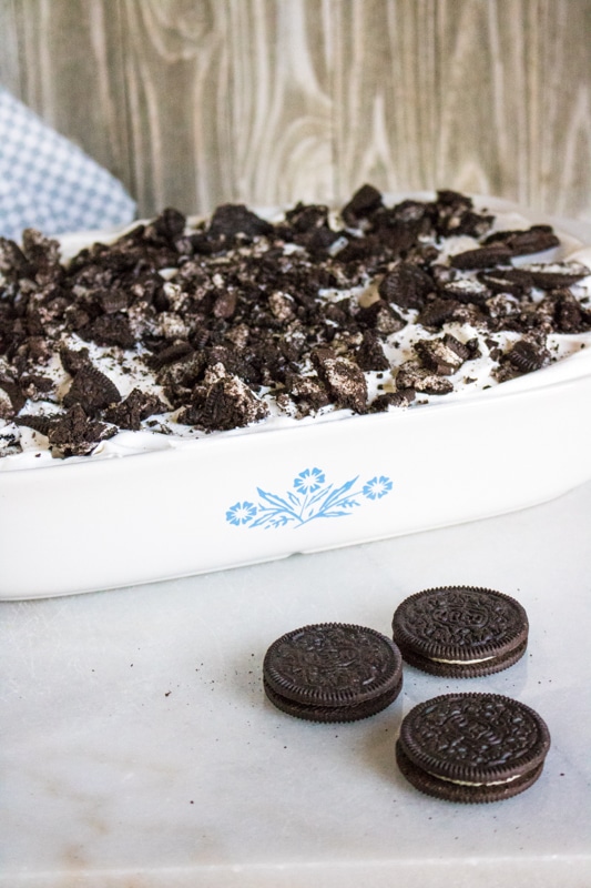 Oreo poke cake being served