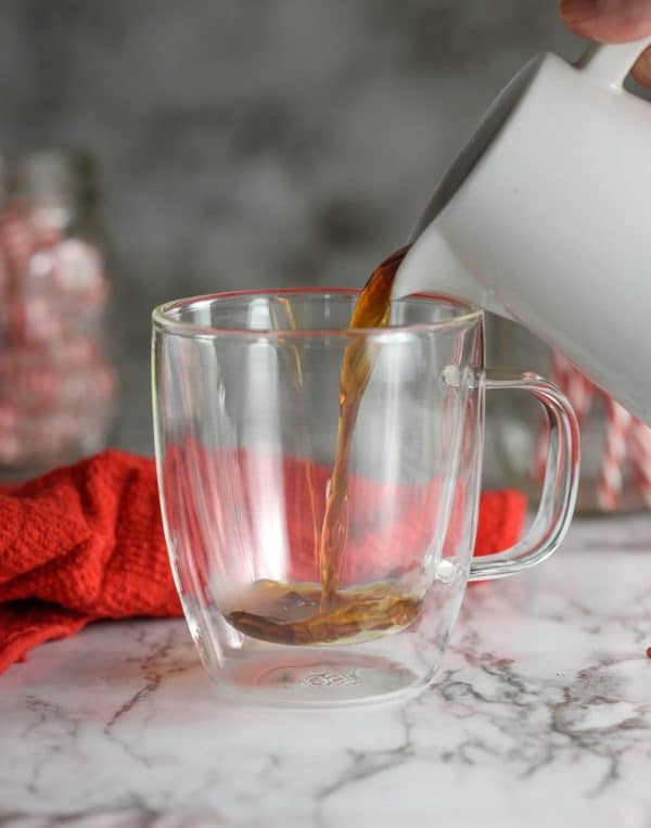 pouring coffee into mug for peppermint chocolatte