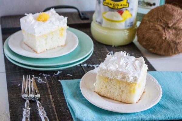 pina colada poke cake on table with ingredients