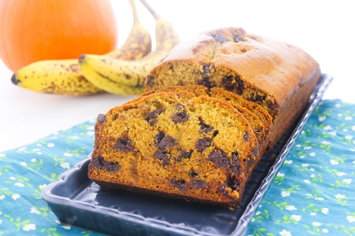 sliced loaf of pumpkin banana bread with chocolate chips