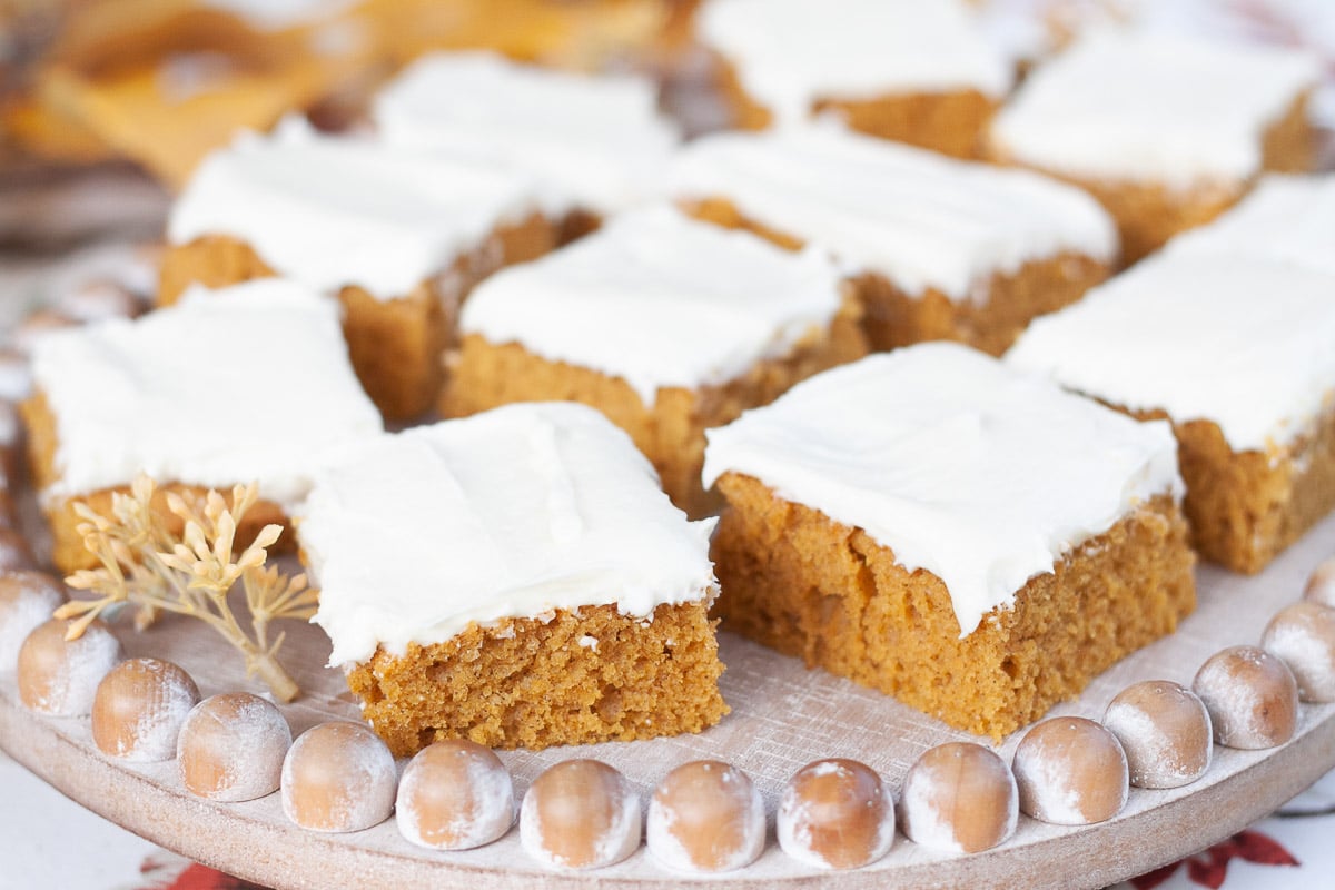 vegan pumpkin bars on wooden display tray