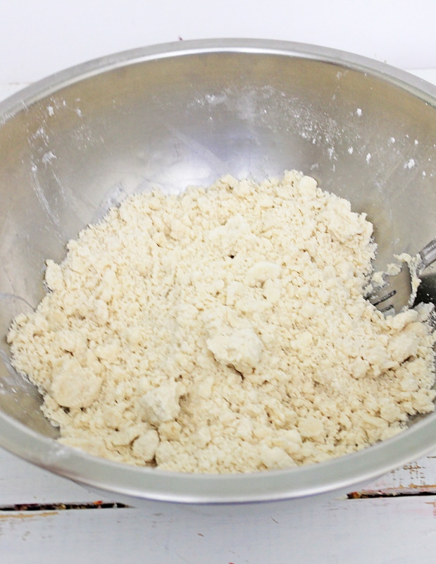 cutting the Crisco into the pumpkin pie dough