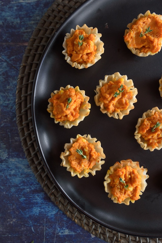 pumpkin puffs topped with thyme sprigs