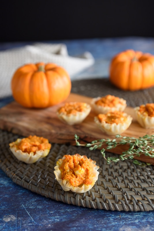 pumpkin puffs being served as an appetizer