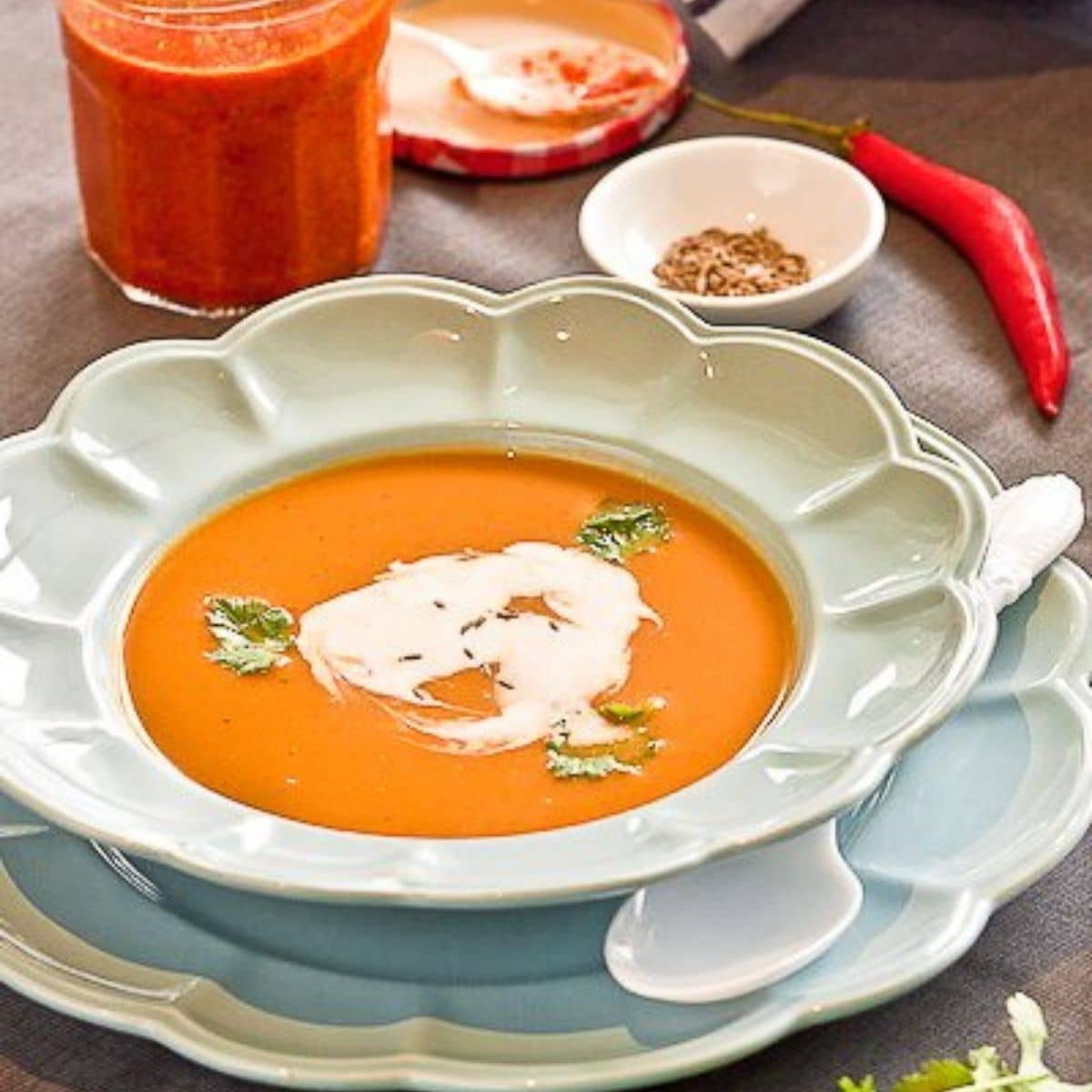 pumpkin and white bean soup in a white bowl