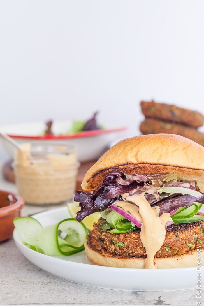 These gourmet vegetarian burger patties are packed with the flavours of ginger, lemongrass, carrot and soy. Top these gluten free veggie burgers with lime and coriander (cilantro) onions and sweet chilli sauce and watch them disappear! | Click for the recipe