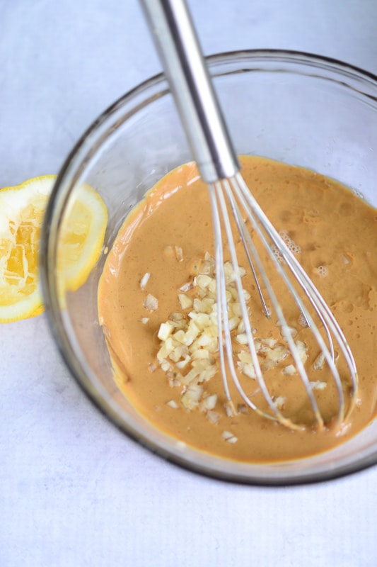 whisking together thai peanut sauce ingredients