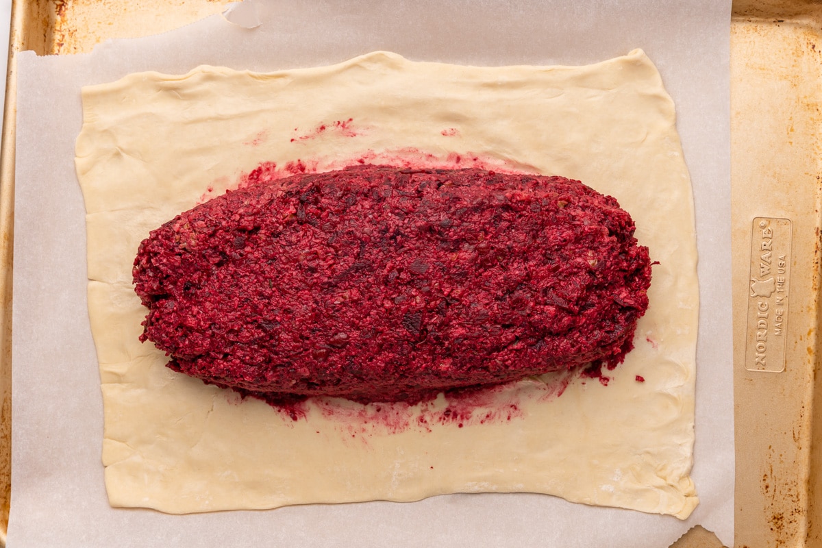 spreading the beet filling on the puff pastry dough