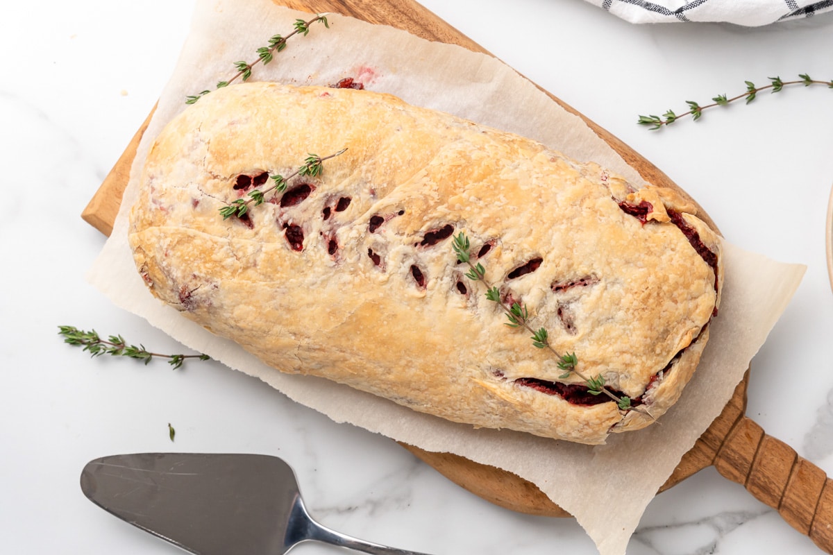 completed beet wellington being served on a cutting board