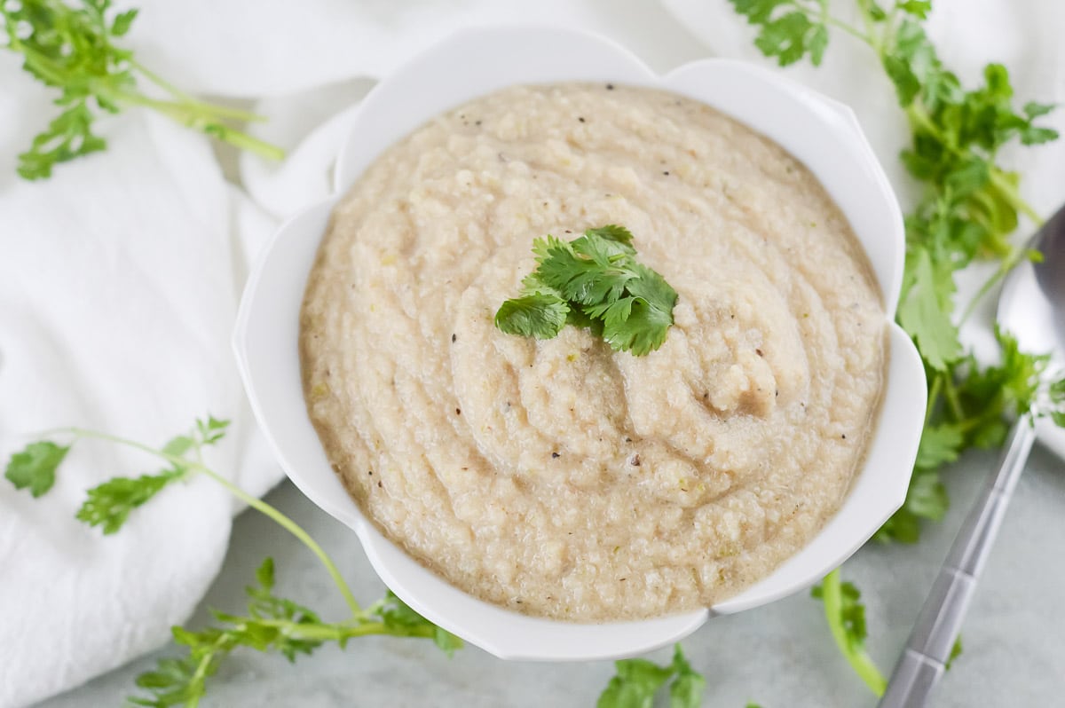 vegan cauliflower soup being served