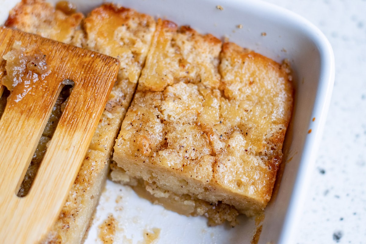 vegan coffee cake being served from a pan
