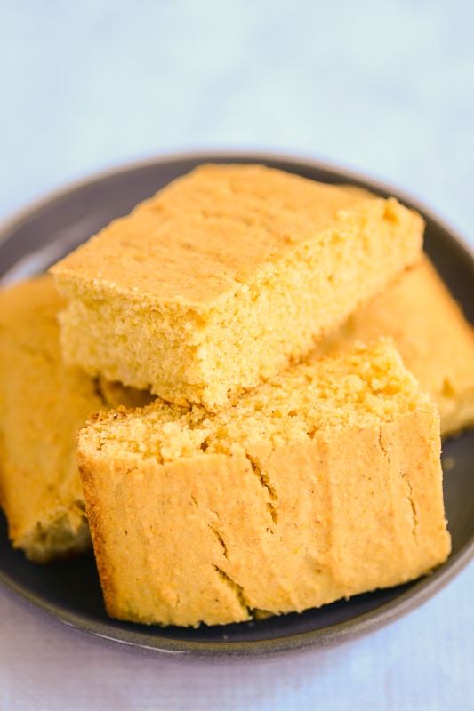 vegan cornbread piled on a plate