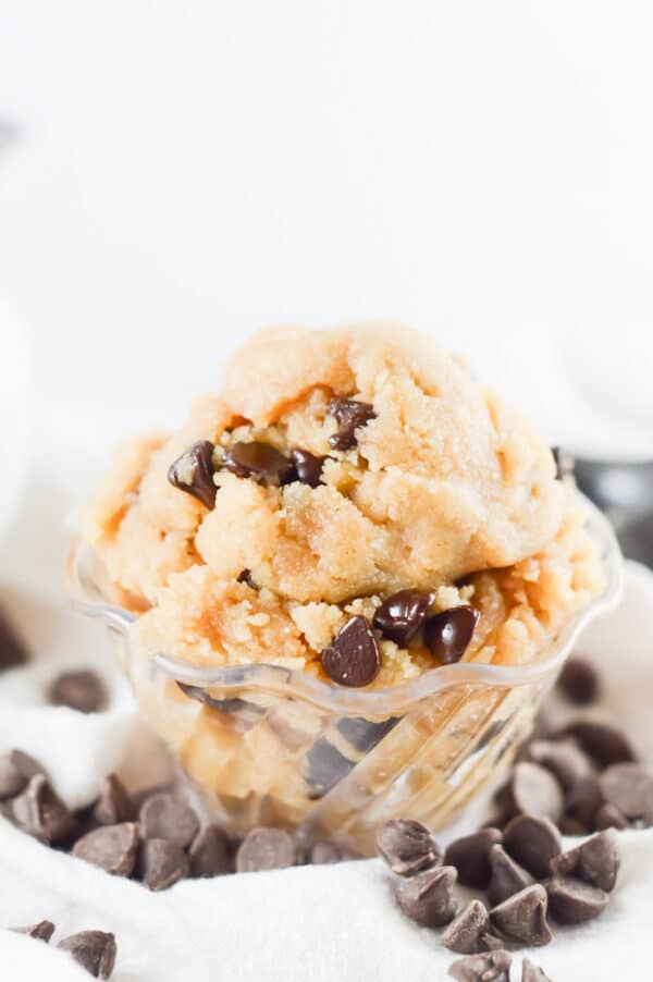 edible vegan cookie dough in a bowl with extra chocolate chips