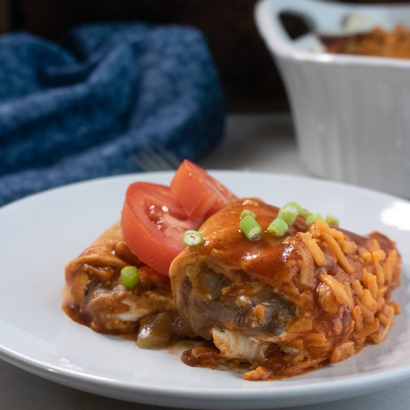 vegan enchiladas with re-fried black beans being served for dinner