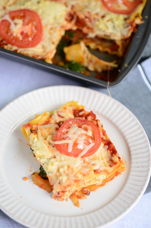 vegan lasagna being served on a white dish