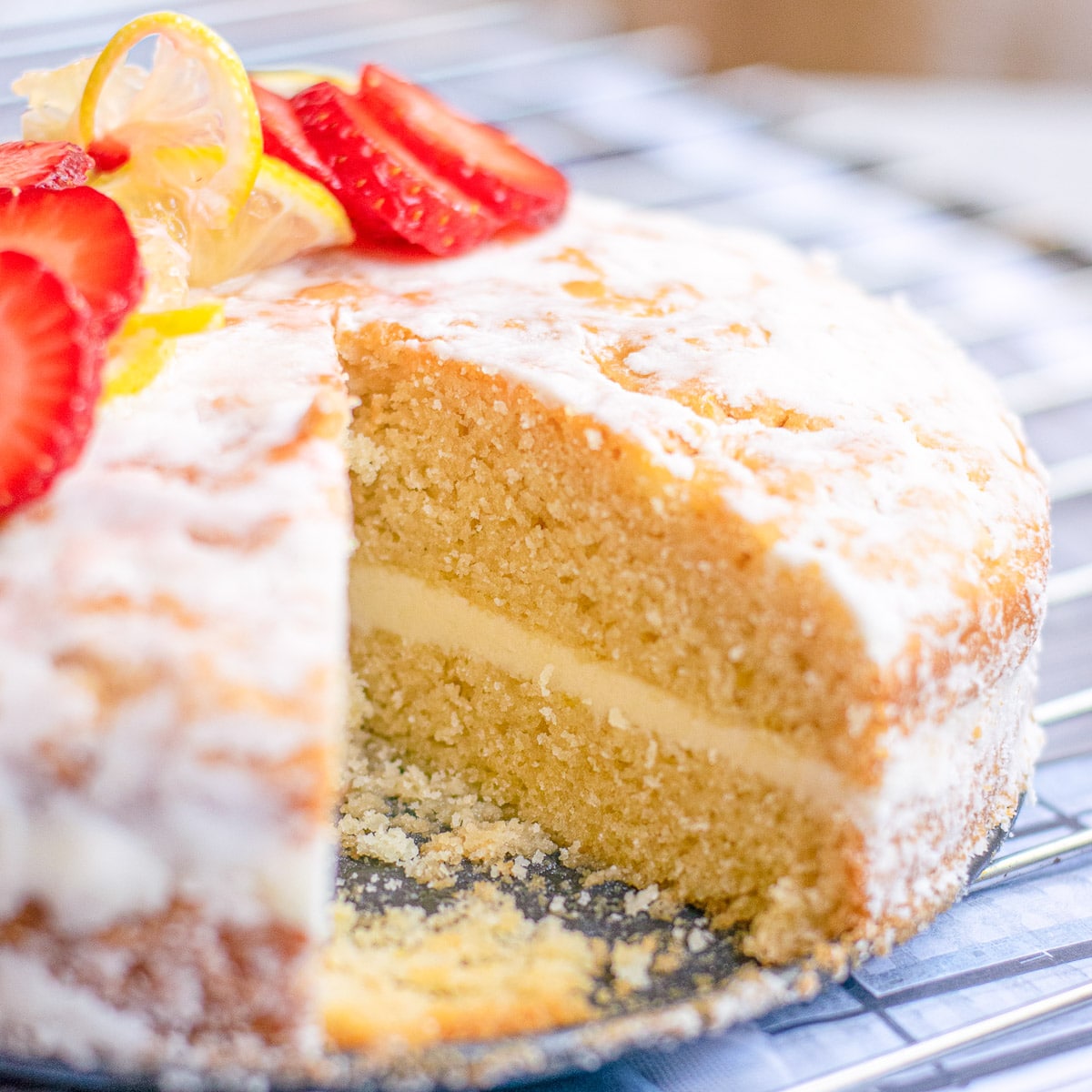 vegan lemon cake with a slice cut out