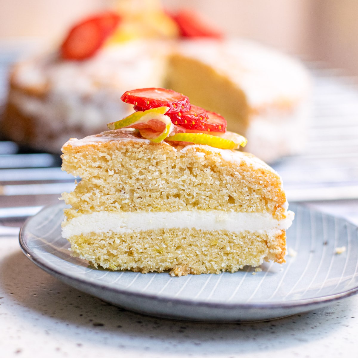 slice of vegan lemon cake on a blue plate