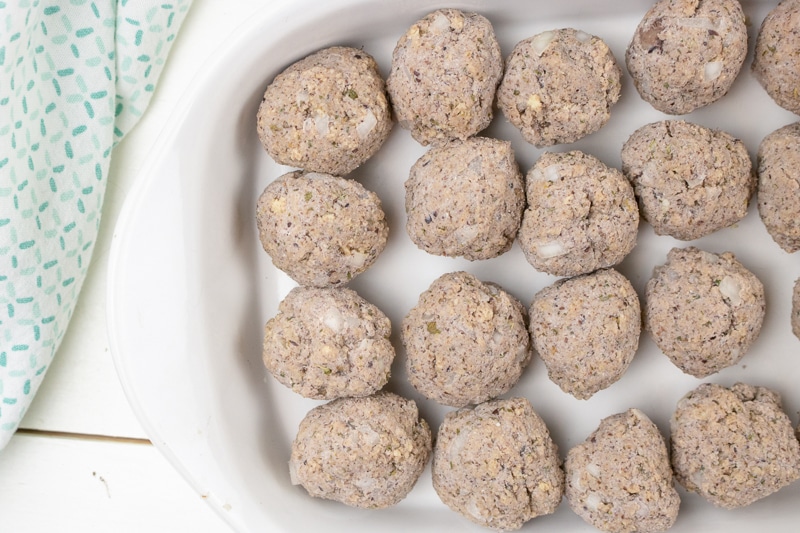 vegan meatballs in a baking dish ready to bake