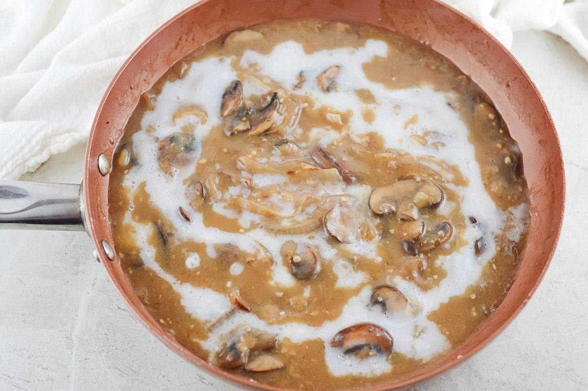 vegan mushroom stroganoff sauce in a red bowl