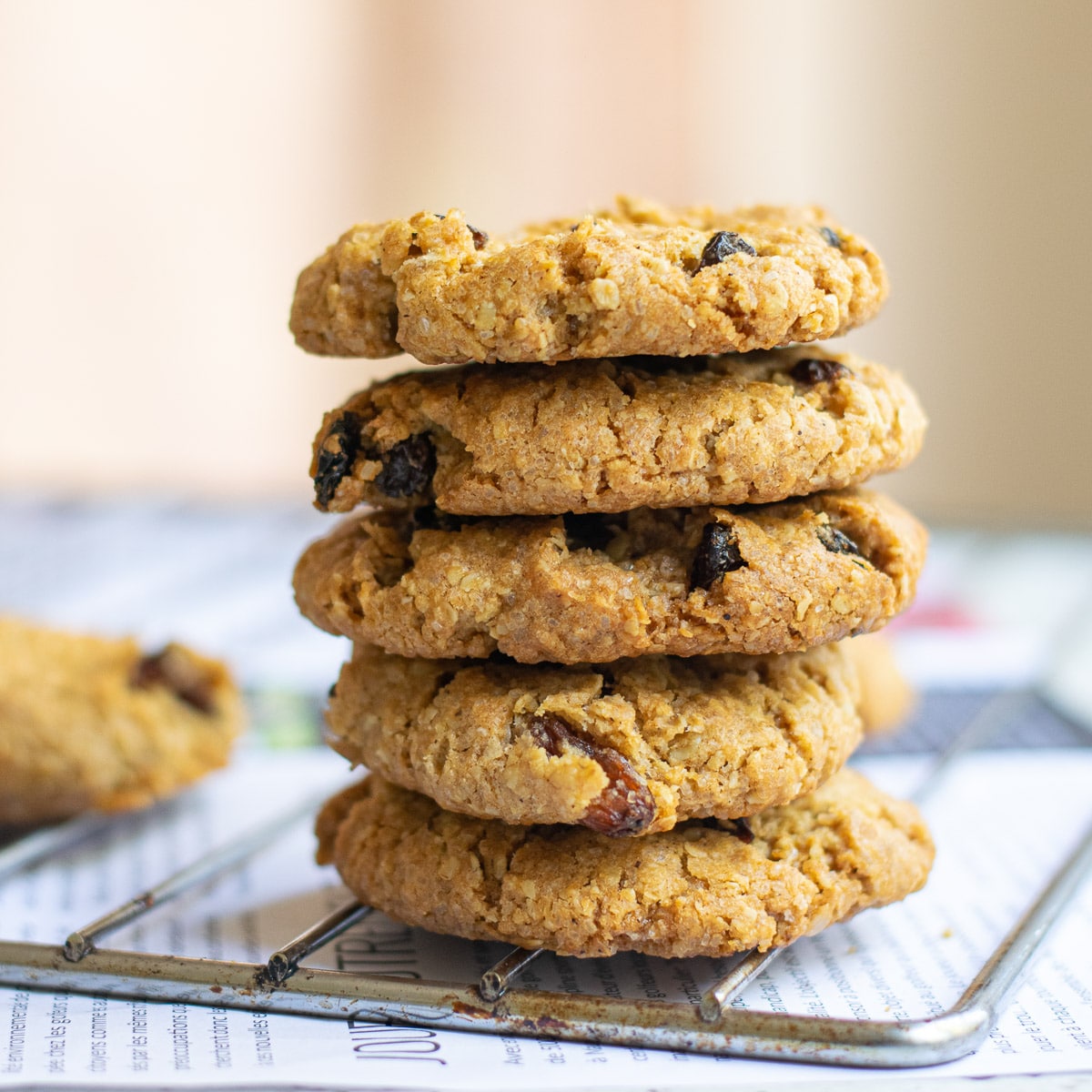 vegan oatmeal raisin cookies on a wire rack