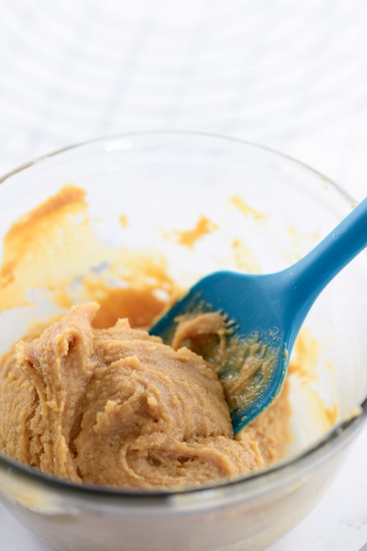 mixing peanut butter into the cookie batter